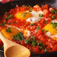 Shakshuka / شكشوكة · eggs, tomatoe paste, onion, tomatoes, salt and pepper