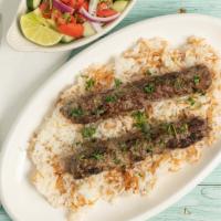 Halal Beef Kofta With Rice · Halal marinated grounded Beef bedded on rice served with salad.
