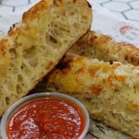 Roasted Garlic Cheese Bread · our fresh house baked bread, topped with shredded mozzarella, parmigiano-reggiano, and garli...