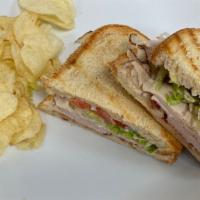 Tbs · Turkey, bacon, and provolone grilled on artisan bread with lettuce, tomato, and mayo.