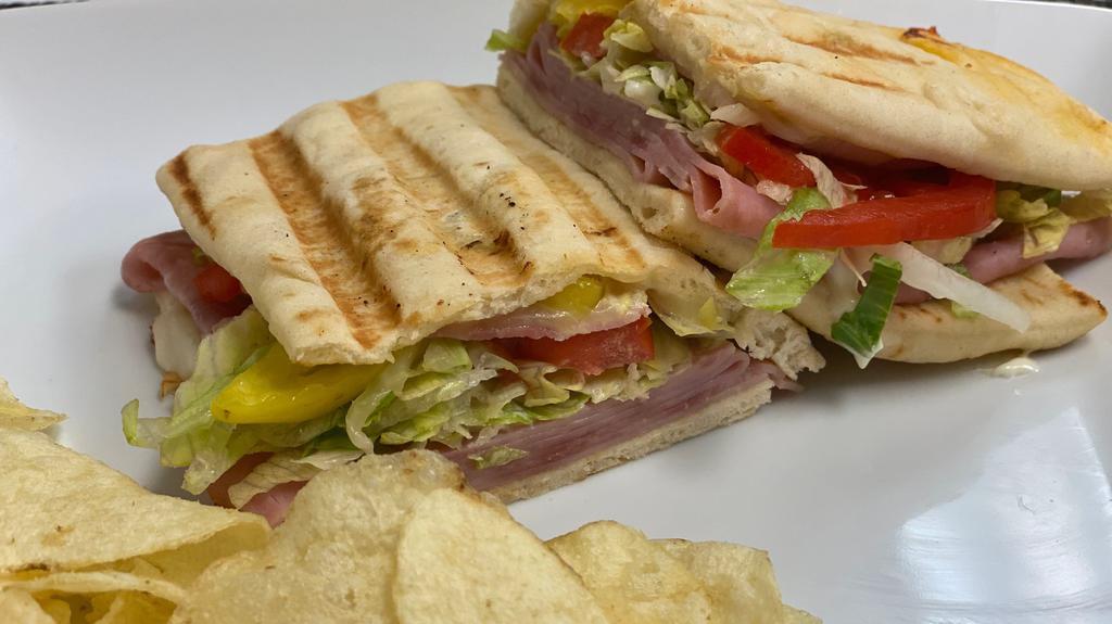 Ham And Cheese Flatbread · Hot ham and cheese on grilled flatbread with lettuce, tomato, and mayo.