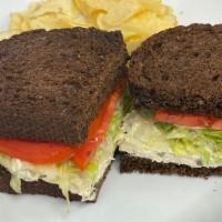 Towboat · Homemade chicken salad with lettuce and tomato on pumpernickel bread.