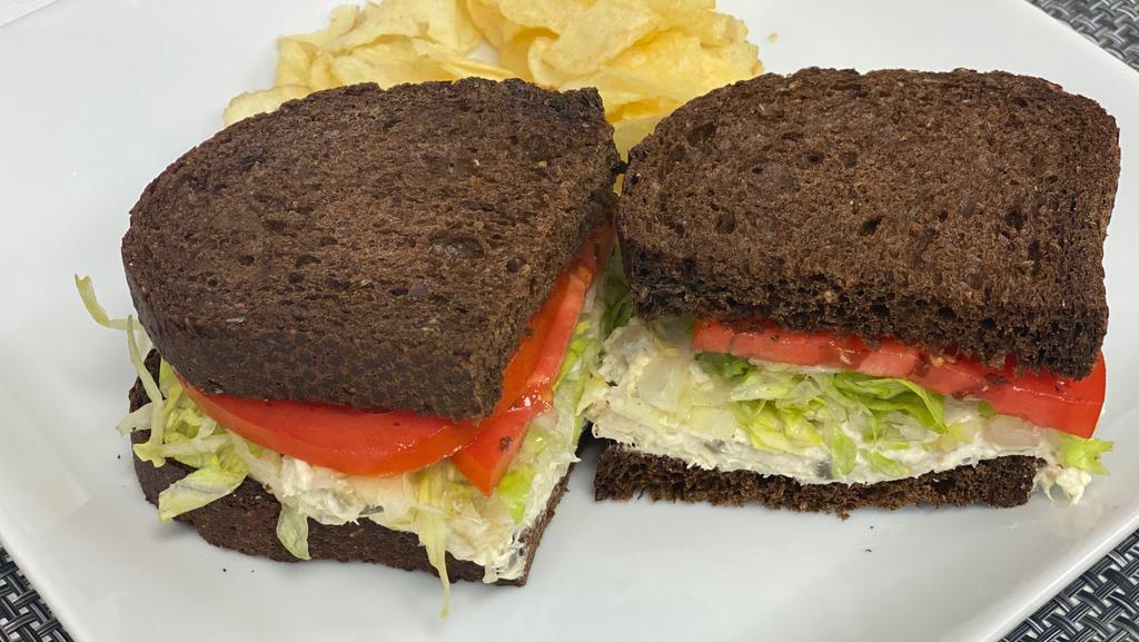 Towboat · Homemade chicken salad with lettuce and tomato on pumpernickel bread.