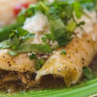 Enchiladas Verdes · Two chicken soft tacos topped with our green tomatillos sauce and cheese served with rice, b...