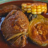 Mole De Olla · Bone-in beef soup cooked with our unique cascabel sauce, zucchini, and corn and cob, served ...