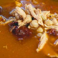 Tlalpeño · Shredded chicken with chipotle sauce, garbanzo, and epazote served with cilantro, onions, an...