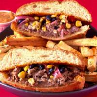 Barbacoa Torta · beer & chile braised beef, black beans, corn pico, pickled red onions