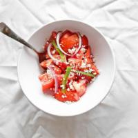 Tomato Salad · Diced tomatoes, onions, jalapeno peppers and black pepper mixed with olive oil, vinegar, lem...