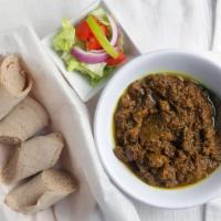 Alicha Siga Wot · Beef stew cooked in turmeric based cooked with exotic spices.