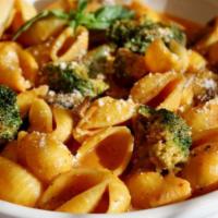 Pasta Con Broccoli · Tomato cream sauce with fresh mushrooms & broccoli on shell pasta