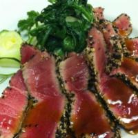 Albacore Tataki · Sashimi style seared albacore tuna topped w/ cilantro, jalapeno, sriracha w/ ginger sesame d...
