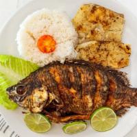 Mojarra Frita · Fried whole tilapia served with a choice of two sides.