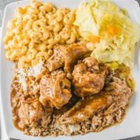 Turkey Wing · Enjoy an entire jumbo turkey wing cut into 5 pieces, served with turkey gravy, white rice, 2...