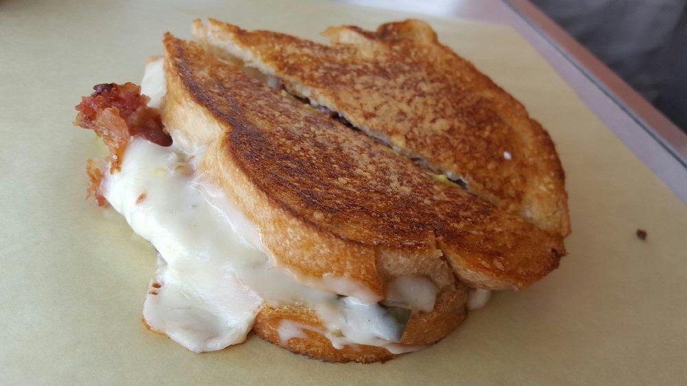 Montana Melt · Lots of bacon, Pepper-Jack, herbed cream cheese, spicy pickles, on Parmesan-crusted sourdough.