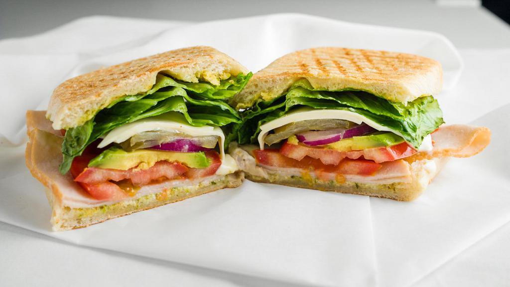 Turkey Ciabatta · Turkey, swiss cheese, fresh tomatoes, avocado, red onions, romaine lettuce, pickles, mustard, mayo  on gourmet ciabatta bread.