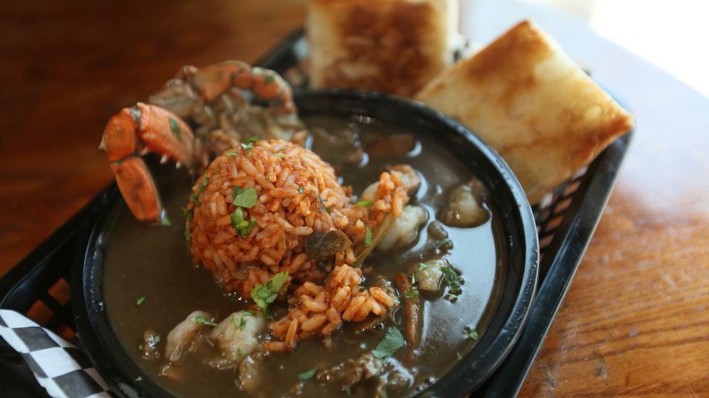 File Gumbo Ya Ya · For the ultimate Gumbo aficionado! Instead of traditional steamed rice, you get a savory blend of Jumbalaya along with freshly baked french bread.