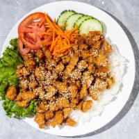 Sesame Chicken Rice Bowl · Sesame chicken, rice, tomato, cucumber and carrot. Gluten-Free. Contains sesame and nightsha...