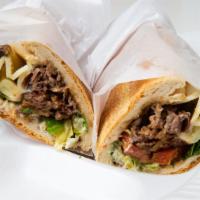Royal Steak And Cheese · Thin sliced fresh rib eye steak with grilled onion, green peppers and melted provolone chees...