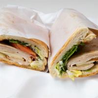Turkey Melt · Grilled thin sliced turkey breast topped with tomato, lettuce and mayo with melted provolone...