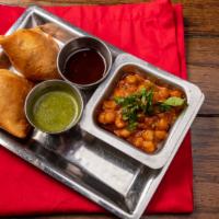 Samosa · Fried spiced potato and peas stuffed pastry, served with a side of chole/chickpeas (2 pcs)