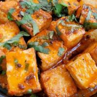 Paneer 65 · Cottage cheese cubes, mustard seeds, curry leaves, vinegar, and tangy sauce.
