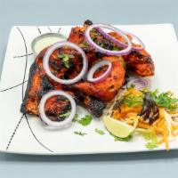 Tandoori Chicken · Chargrilled whole chicken marinated in yogurt and our house spices blend