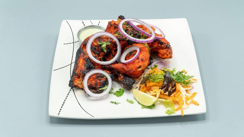 Tandoori Chicken · Chargrilled whole chicken marinated in yogurt and our house spices blend
