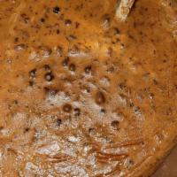 Dal Makhani · Black lentil and red kidney beans cooked overnight and finished with cream and butter