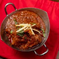 Kashmiri Goat Curry · Baby goat cooked in chef special kashmiri ingredients.