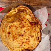 Lachedar Paratha · Flaky whole wheat Indian bread with buttery layers.