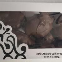 Dark Cashew Tuttles · Copper-kettle caramel select cashews and irresistible kilwins dark chocolate.