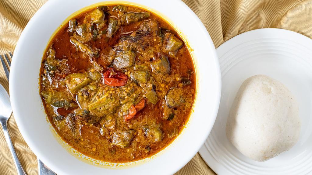 Banku With Okra Soup · Okra cooked in palm oil with onions, tomatoes, herbs and spices.