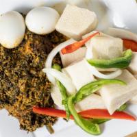 Spinach & Egusi Stew · Spinach and melon seeds cooked in onions, tomatoes, herbs and spices.