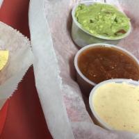 Triple Dip · Guacamole, queso, and chunky salsa & served with chips for dipping.