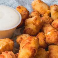 Small Regular Curds · Large gooey, melted cheese deep fried in a golden brown batter and served with ranch.