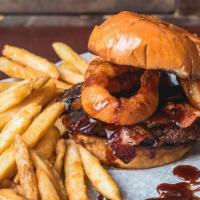 Cowboy Burger · Fresh burger topped with onion ring, bacon, and cheddar cheese. Drizzled with BBQ sauce