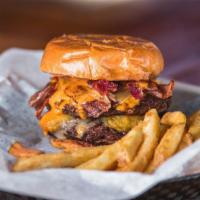 Big Dill · Two beef patties, pickle chips, Monterey jack cheese, spicy ranch, and bacon. This burger is...