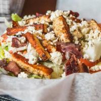 Bleu Bacon Salad · Crispy lettuce topped with bleu cheese, bacon crumbles, grilled chicken, diced tomato, and d...