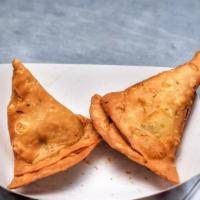  Veggie Samosa (2 Pieces) · Fried pastry with a savory filling such as potato & peas served with tamarind chutney.