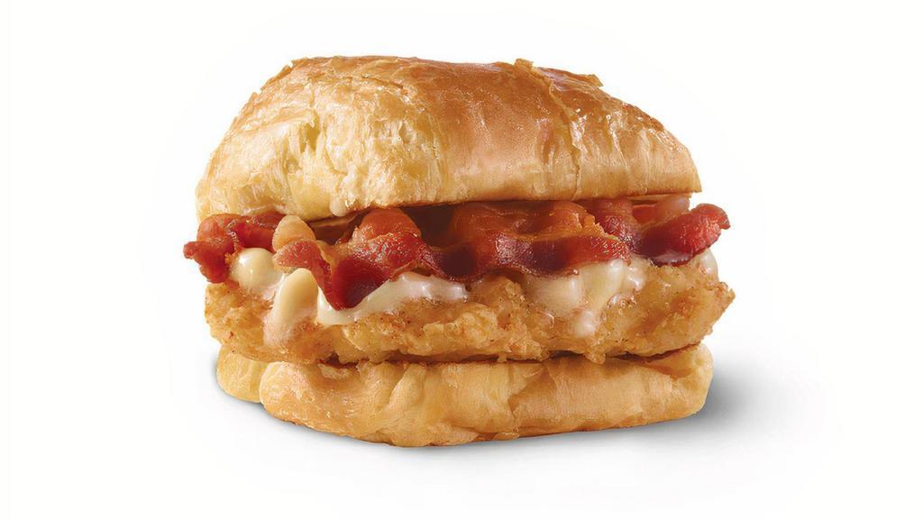 Maple Bacon Chicken Croissant · A juicy chicken breast, Applewood smoked bacon, and maple butter on a flaky croissant bun. A little sweet. A little savory. A lot good.