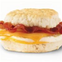 Bacon, Egg & Cheese Biscuit · A fresh-cracked grade A egg on a fluffy buttermilk biscuit with Applewood smoked bacon and m...