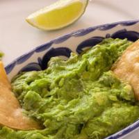 House Guacamole - Large · Our house made guacamole, served with Chips & Salsas and a side of diced fresh jalapeños and...