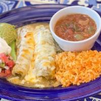 Enchilada Verdes Dinner · Two shredded chicken enchiladas topped with tomatillo sauce, melted cheese and a side of sou...