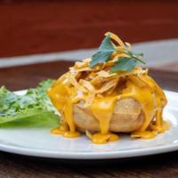 Stuffed Puffy Queso · Los Tios famous puffy crispy shell stuffed with grilled chicken or beef, refried beans, lett...