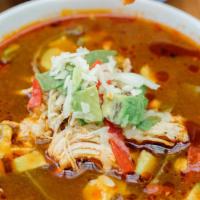 Famous Tortilla Soup · Chicken broth, shredded chicken, tortilla strips, sliced avocado and cheese.