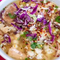 Pork Pozole · Pork, maize and spices in a rich broth. Served with garnish of oregano, cabbage and crushed ...