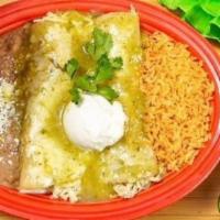 Suizas Enchiladas · Two corn tortillas filled with shredded chicken. Topped with melted cheese, green sauce and ...