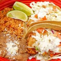 Baja Style Fish Taco · Two soft corn tortillas filled with fried battered fish fillets. Topped with cabbage and jal...