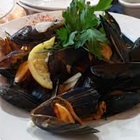 Mussels Masala · Fresh jumbo Penn Cove mussels cooked with chef's special creamy garlic curry sauce.