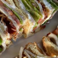 Club Sandwich · A triple decker layered with turkey bacon, swiss cheese, lettuce, tomatoes and mayo on your ...